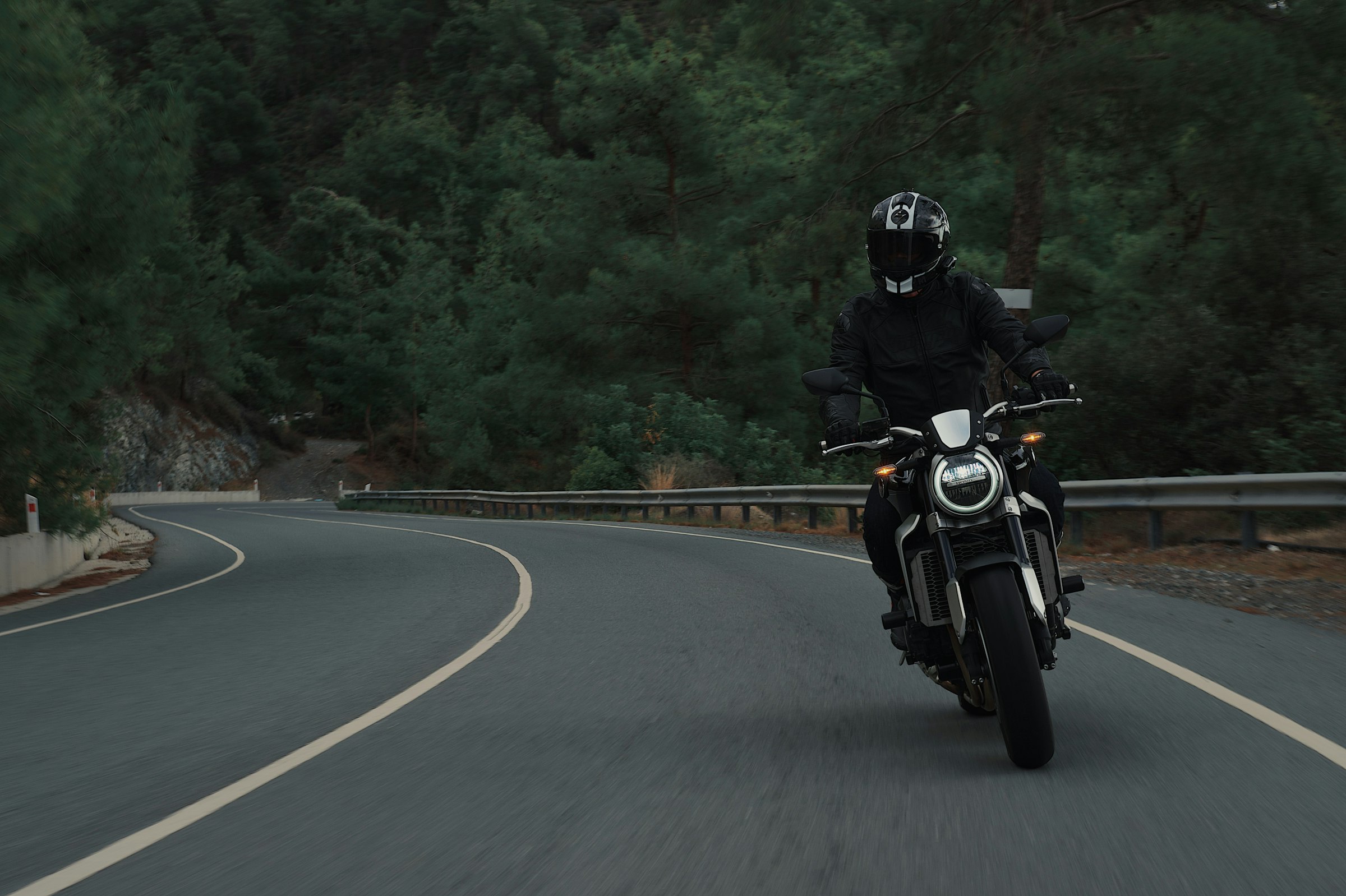 Motorcyclist riding along a winding road