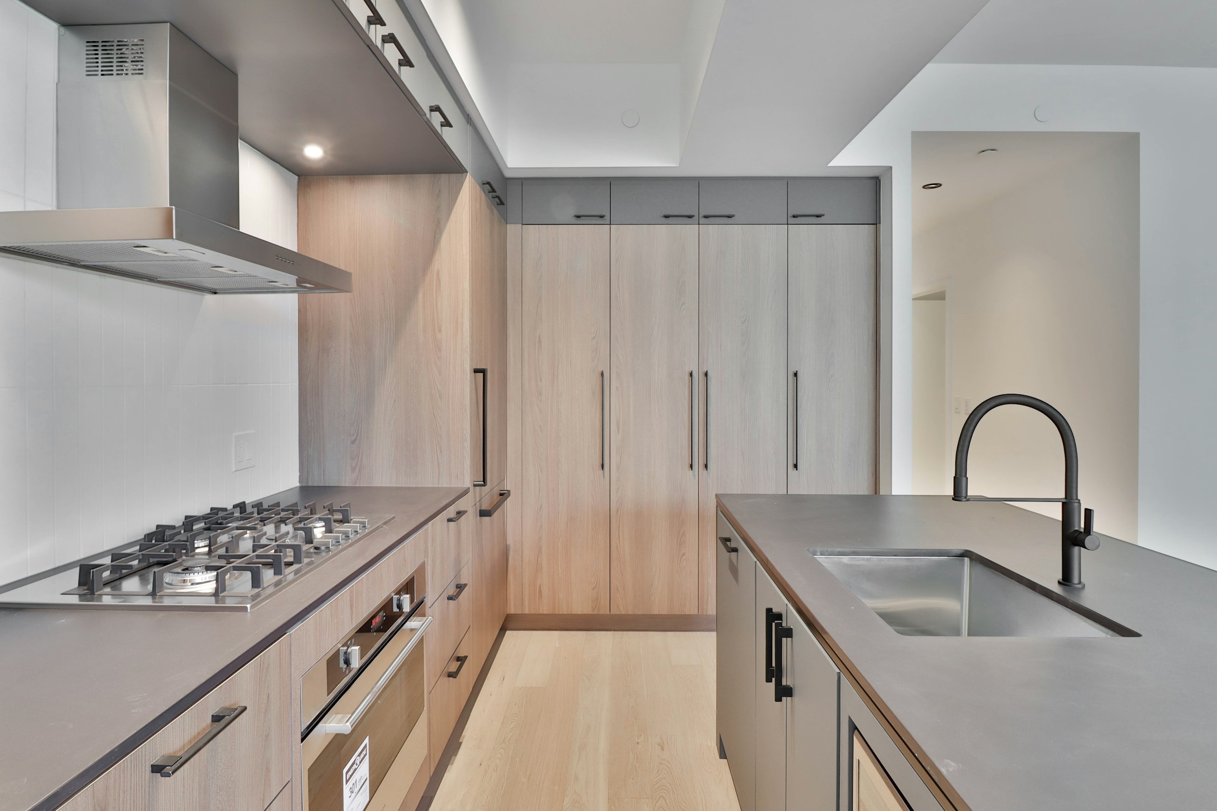 Modern handleless kitchen with tall flat cabinet doors