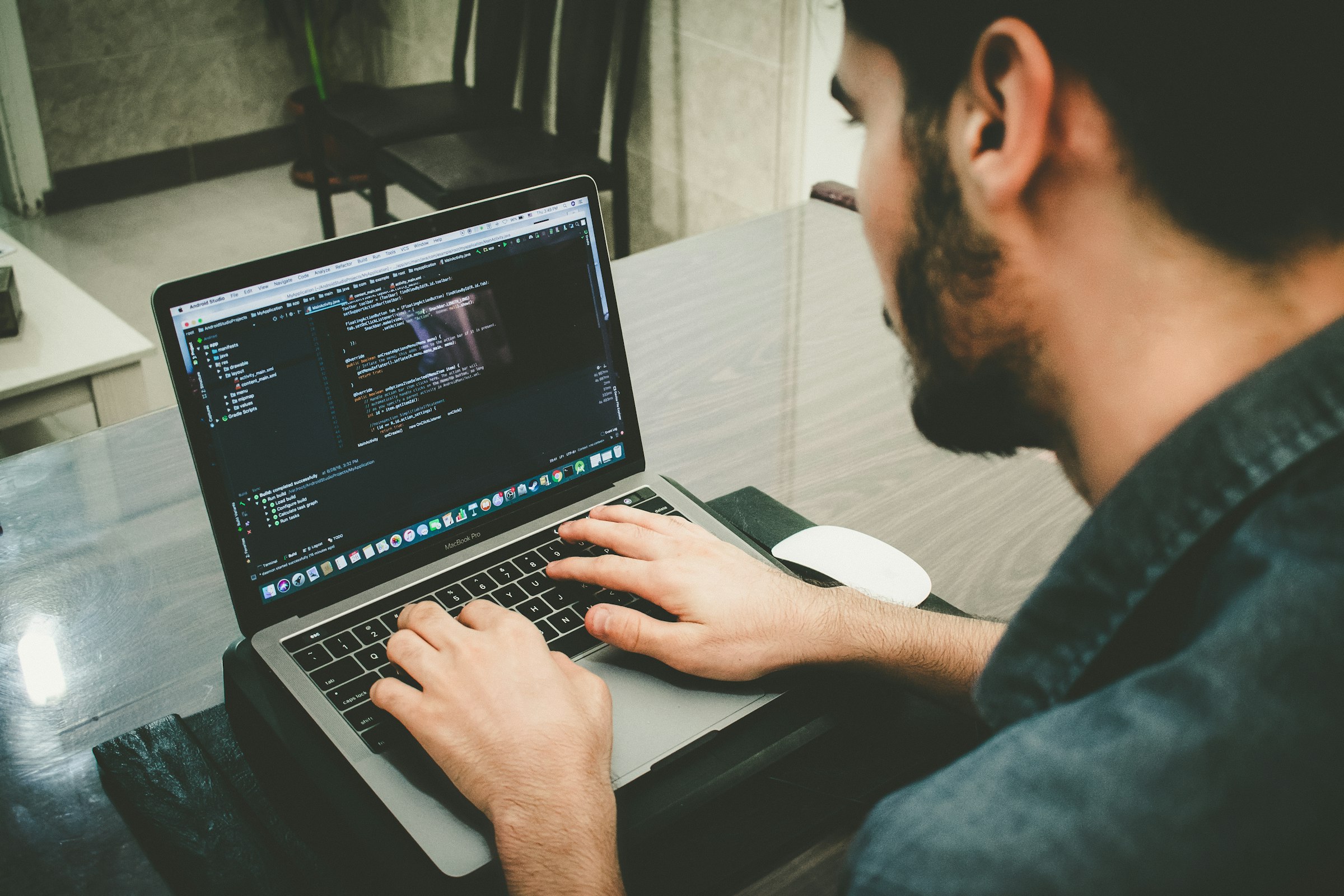Developer programming on a laptop