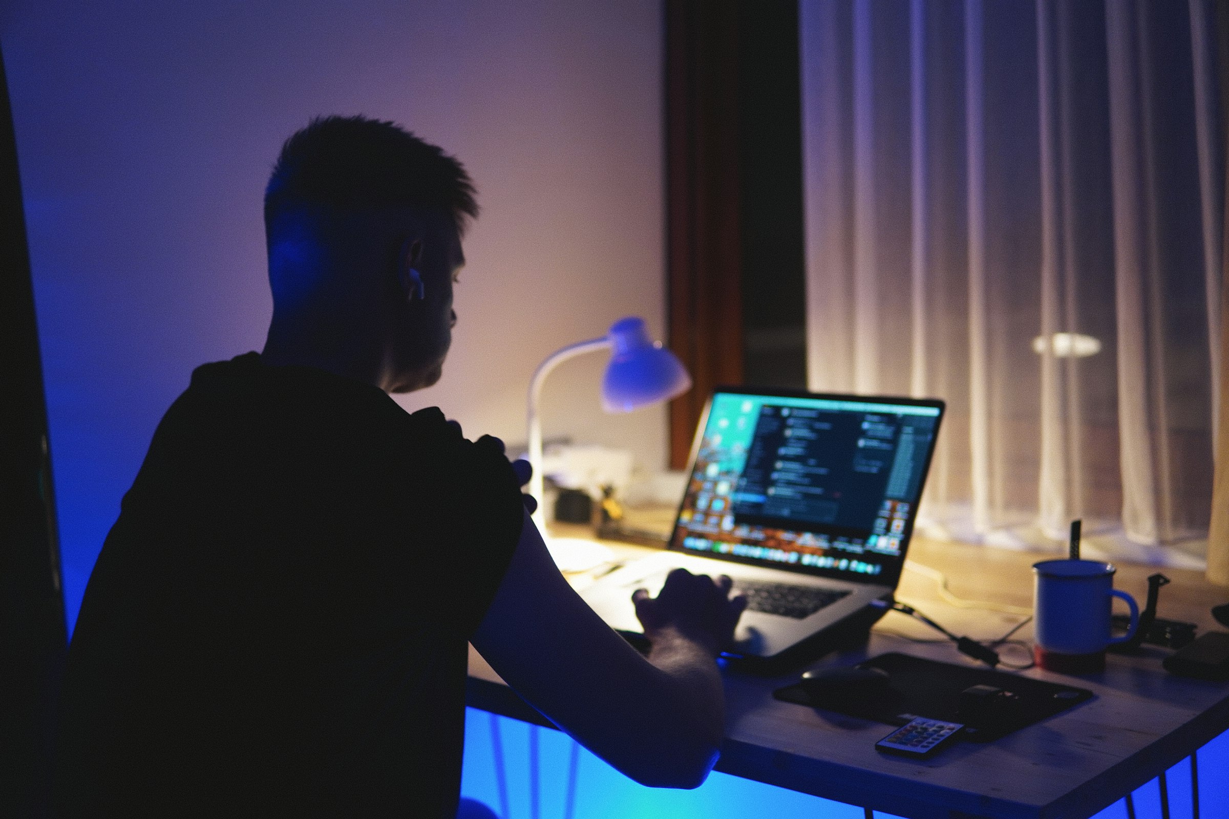 Founder working late at a desk on a laptop